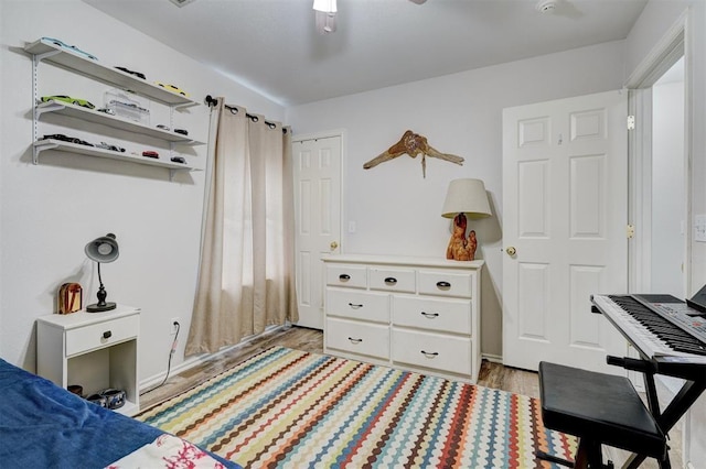 12308 Hickory Creek Blvd, Oklahoma City, OK 73170 - bedroom featuring light wood-style flooring and a ceiling fan