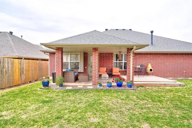 12308 Hickory Creek Blvd, Oklahoma City, OK 73170 - back of house featuring brick siding, a shingled roof, and a deck