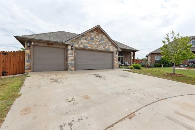 12116 NW 137th St, Piedmont, OK 73078 - view of front of property with a garage, driveway, and stone siding