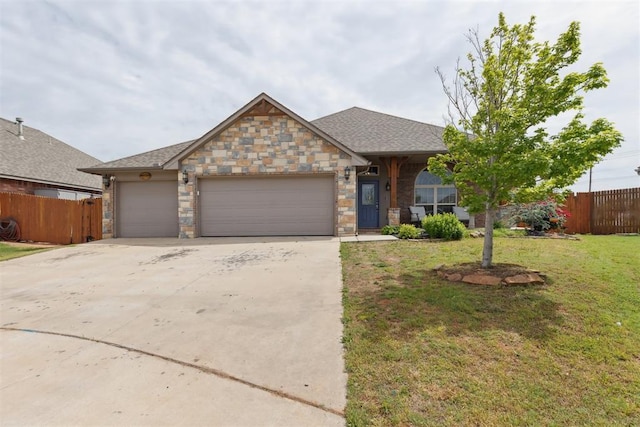 12116 NW 137th St, Piedmont, OK 73078 - view of front of home featuring an attached garage, driveway, and stone siding