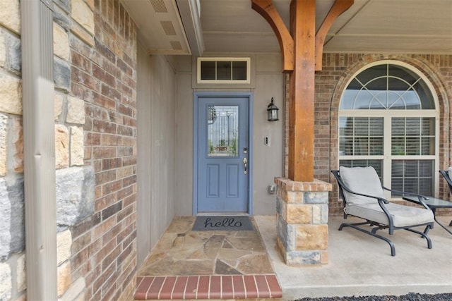 12116 NW 137th St, Piedmont, OK 73078 - property entrance with covered porch and brick siding