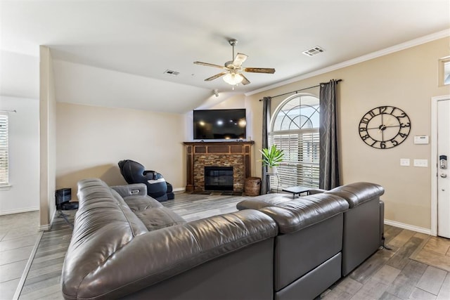 12116 NW 137th St, Piedmont, OK 73078 - living room featuring ceiling fan, a fireplace, wood finished floors, baseboards, and crown molding