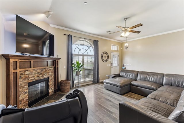 12116 NW 137th St, Piedmont, OK 73078 - living area with a ceiling fan, a fireplace, crown molding, wood finished floors, and baseboards