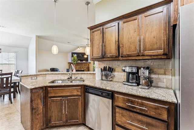 12116 NW 137th St, Piedmont, OK 73078 - kitchen with stainless steel appliances, a sink, a peninsula, decorative backsplash, and lofted ceiling