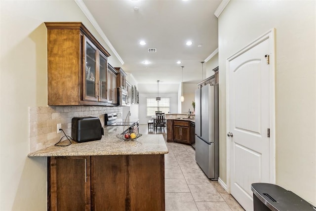 12116 NW 137th St, Piedmont, OK 73078 - kitchen featuring appliances with stainless steel finishes, a peninsula, glass insert cabinets, a sink, and backsplash