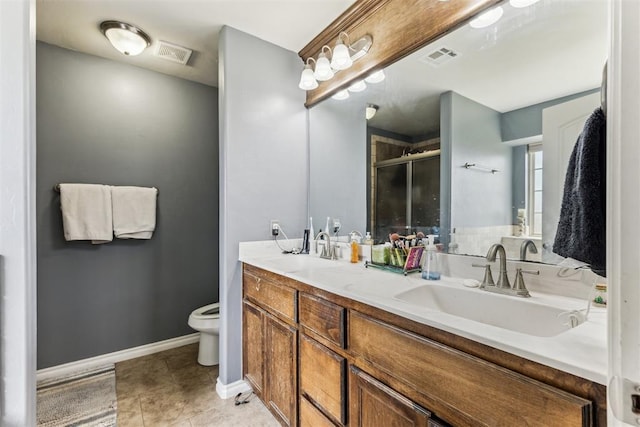 12116 NW 137th St, Piedmont, OK 73078 - full bathroom with a stall shower, toilet, double vanity, tile patterned floors, and baseboards