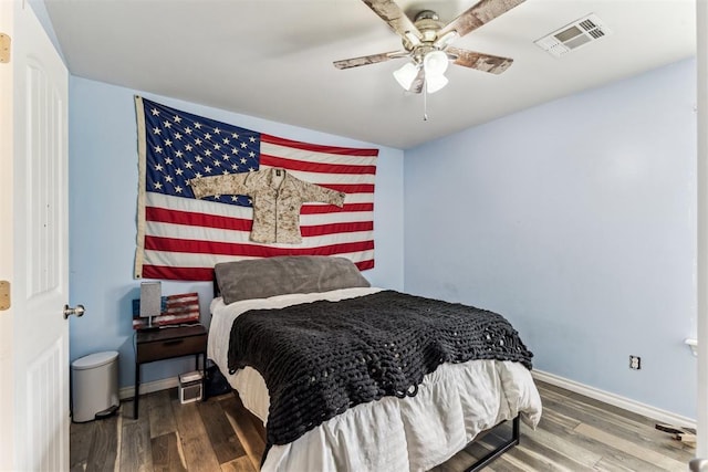 12116 NW 137th St, Piedmont, OK 73078 - bedroom featuring wood finished floors, baseboards, and ceiling fan