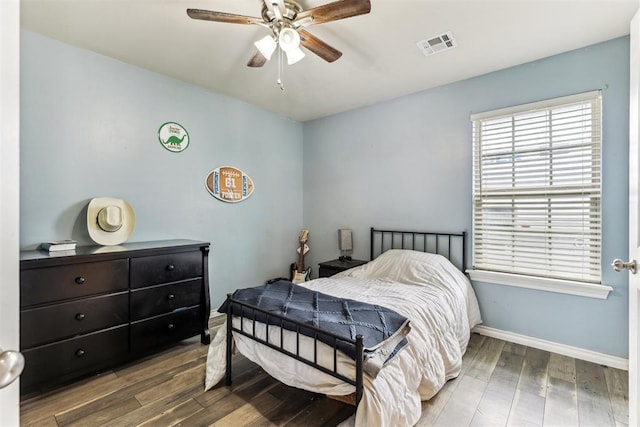 12116 NW 137th St, Piedmont, OK 73078 - bedroom featuring wood finished floors, baseboards, and ceiling fan