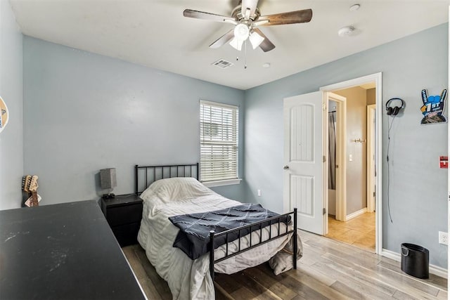 12116 NW 137th St, Piedmont, OK 73078 - bedroom featuring wood finished floors, ceiling fan, and baseboards