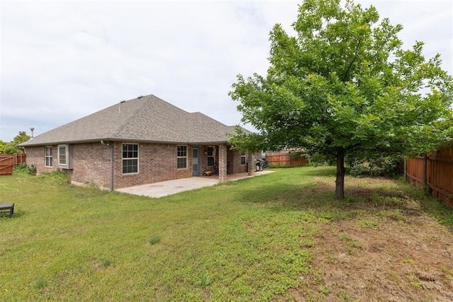 12116 NW 137th St, Piedmont, OK 73078 - back of house with a patio area, brick siding, and a shingled roof