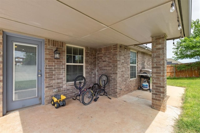 12116 NW 137th St, Piedmont, OK 73078 - view of patio / terrace with grilling area and fence