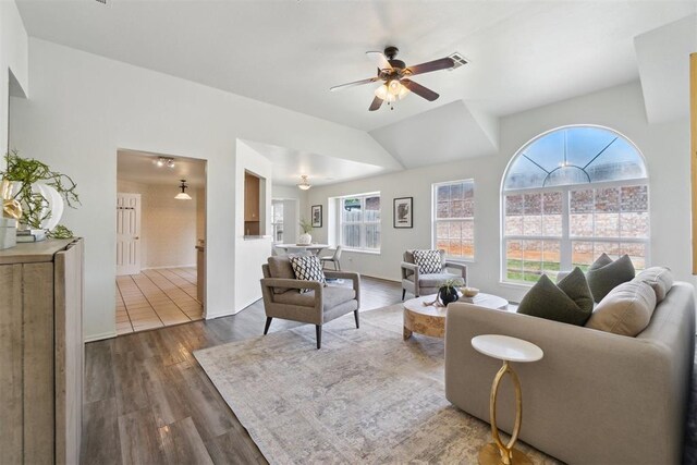 2013 Cedar Meadow Ln, Edmond, OK 73003 - living room with plenty of natural light, a ceiling fan, and dark wood-type flooring
