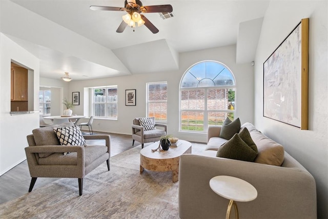 2013 Cedar Meadow Ln, Edmond, OK 73003 - living room featuring wood finished floors, lofted ceiling, ceiling fan, and baseboards