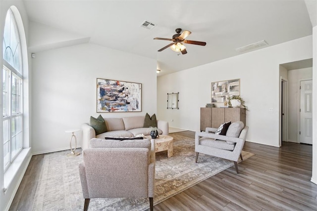 2013 Cedar Meadow Ln, Edmond, OK 73003 - living room with wood finished floors, plenty of natural light, ceiling fan, and vaulted ceiling