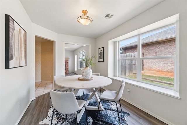 2013 Cedar Meadow Ln, Edmond, OK 73003 - dining room featuring baseboards and wood finished floors
