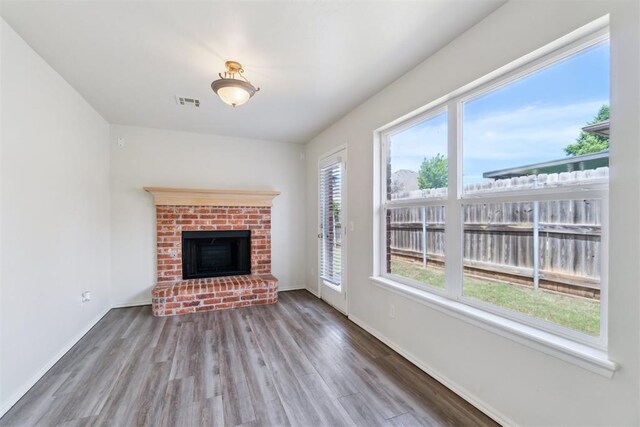 2013 Cedar Meadow Ln, Edmond, OK 73003 - unfurnished living room with wood finished floors, baseboards, and a fireplace