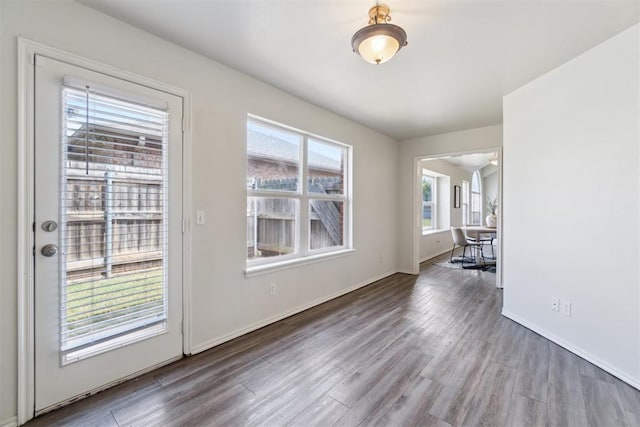 2013 Cedar Meadow Ln, Edmond, OK 73003 - unfurnished dining area with wood finished floors and baseboards