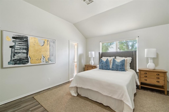 2013 Cedar Meadow Ln, Edmond, OK 73003 - bedroom with vaulted ceiling, wood finished floors, and baseboards
