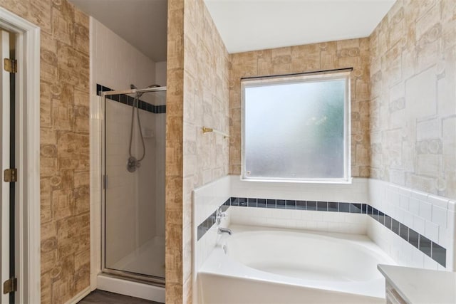 2013 Cedar Meadow Ln, Edmond, OK 73003 - bathroom featuring healthy amount of natural light, a bath, and a shower stall