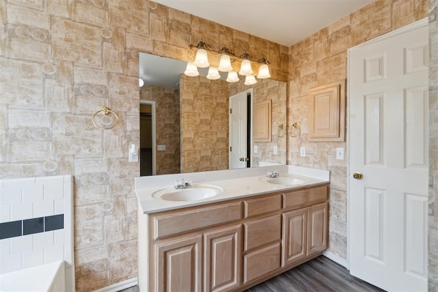 2013 Cedar Meadow Ln, Edmond, OK 73003 - full bath featuring double vanity, tile walls, and wood finished floors
