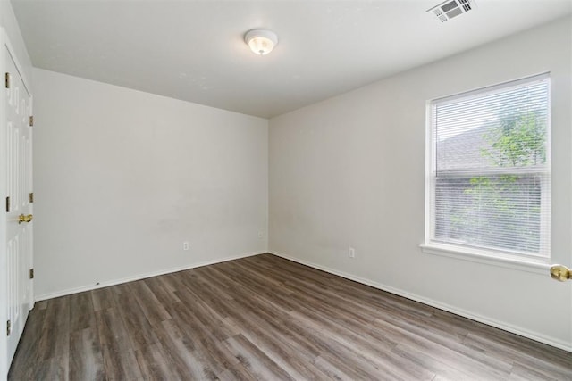 2013 Cedar Meadow Ln, Edmond, OK 73003 - empty room with wood finished floors and baseboards
