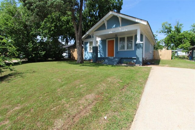 1016 N Louisa Ave, Shawnee, OK 74801 - view of front of home featuring a front yard and covered porch