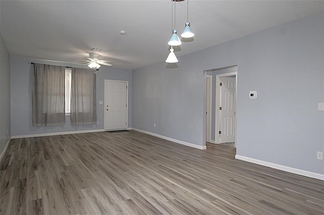 1016 N Louisa Ave, Shawnee, OK 74801 - unfurnished room featuring wood finished floors and baseboards