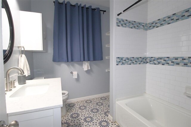 1016 N Louisa Ave, Shawnee, OK 74801 - bathroom with baseboards, vanity, toilet, and bathing tub / shower combination