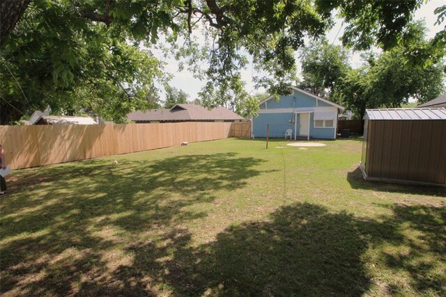 1016 N Louisa Ave, Shawnee, OK 74801 - view of yard with a storage unit and an outbuilding