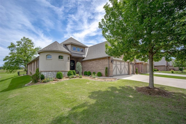3716 Doningham Dr, Edmond, OK 73034 - view of front of house featuring driveway, a garage, a front lawn, roof with shingles, and stone siding