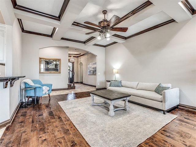 3716 Doningham Dr, Edmond, OK 73034 - living area with arched walkways, coffered ceiling, ceiling fan, baseboards, and crown molding