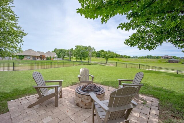3716 Doningham Dr, Edmond, OK 73034 - view of patio / terrace with a fire pit