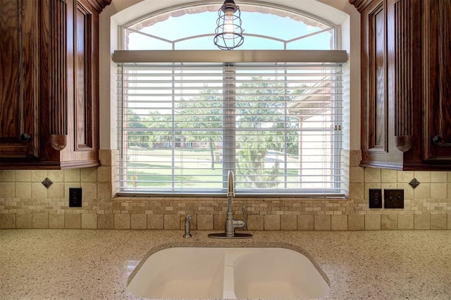 16371 Sandstone Cir, Choctaw, OK 73020 - detailed view of a sink, backsplash, and light stone countertops
