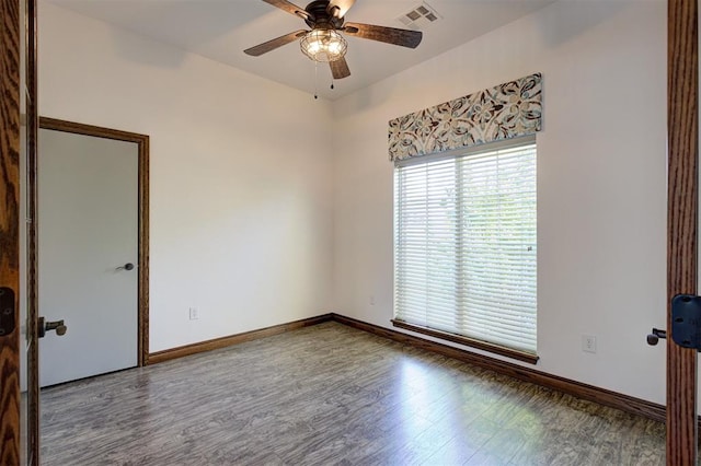16371 Sandstone Cir, Choctaw, OK 73020 - empty room featuring wood finished floors, ceiling fan, and baseboards