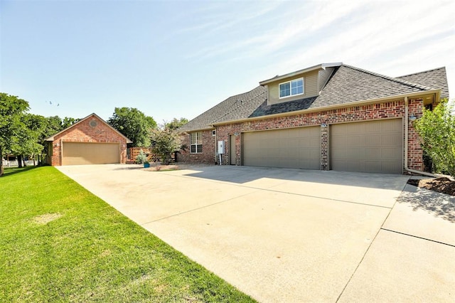 16371 Sandstone Cir, Choctaw, OK 73020 - view of front facade featuring brick siding, a front yard, roof with shingles, and driveway