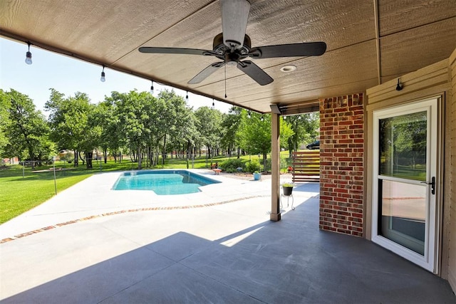 16371 Sandstone Cir, Choctaw, OK 73020 - outdoor pool with a patio, ceiling fan, a yard, and view of scattered trees