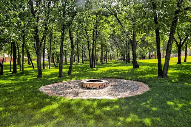 16371 Sandstone Cir, Choctaw, OK 73020 - view of green lawn featuring an outdoor fire pit