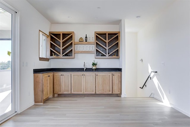 577 S Fretz Ave, Edmond, OK 73003 - indoor wet bar featuring light wood-style floors and baseboards