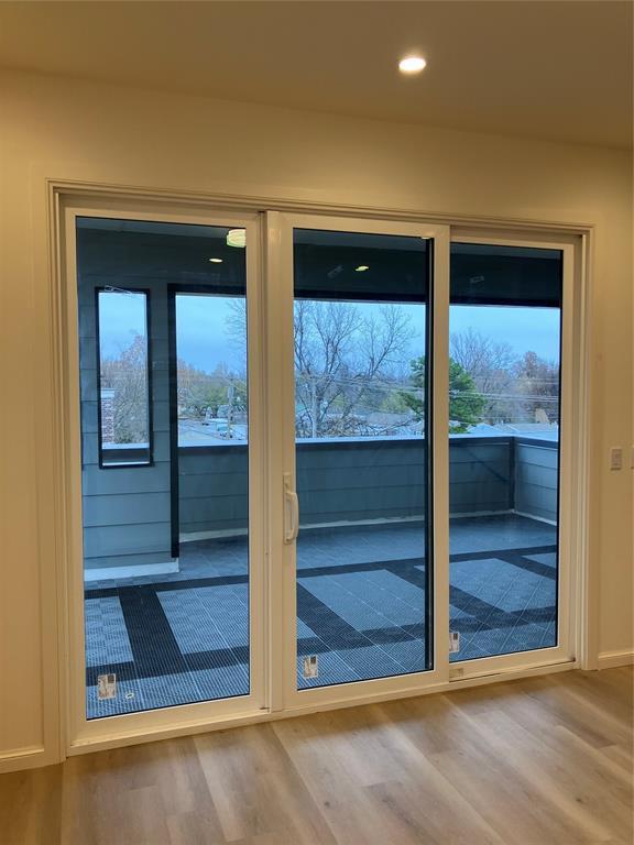 577 S Fretz Ave, Edmond, OK 73003 - doorway with wood finished floors, recessed lighting, and baseboards