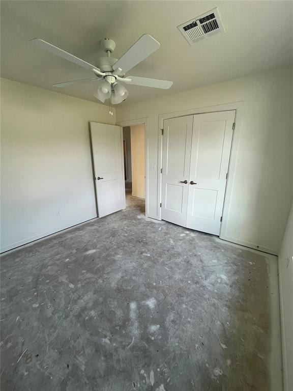 unfurnished bedroom featuring concrete floors, a closet, and ceiling fan