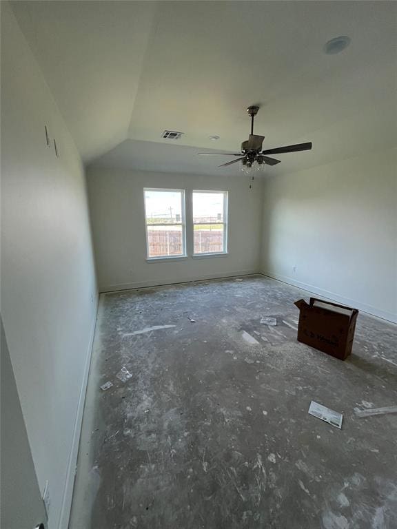 spare room featuring ceiling fan and baseboards