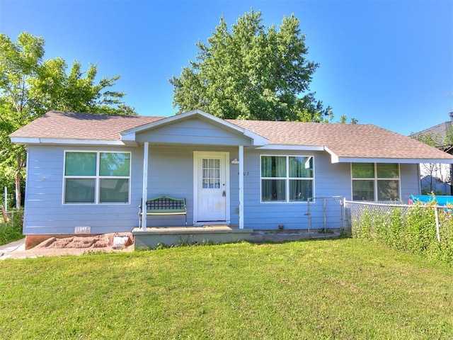 ranch-style house featuring covered porch and a shingled roof