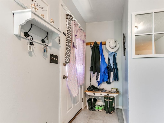 mudroom featuring tile patterned flooring and baseboards