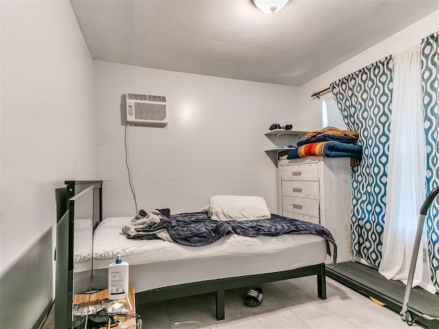 bedroom with a wall unit AC