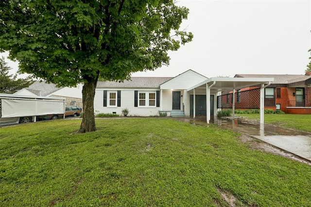 3128 NW 44th St, Oklahoma City, OK 73112 - view of front of property featuring concrete driveway, a front yard, and an attached carport