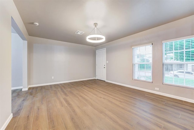 3128 NW 44th St, Oklahoma City, OK 73112 - unfurnished room with wood finished floors and baseboards
