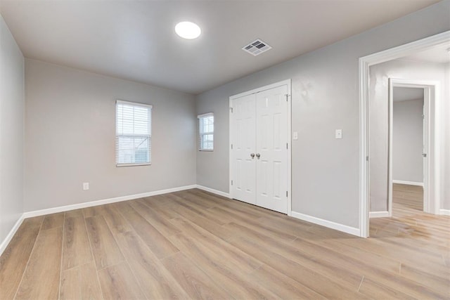 3128 NW 44th St, Oklahoma City, OK 73112 - unfurnished bedroom with light wood-type flooring, baseboards, and a closet