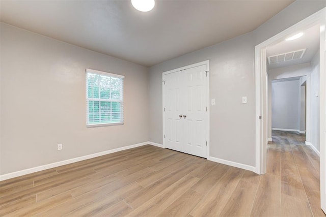 3128 NW 44th St, Oklahoma City, OK 73112 - unfurnished bedroom with light wood-type flooring, baseboards, and a closet