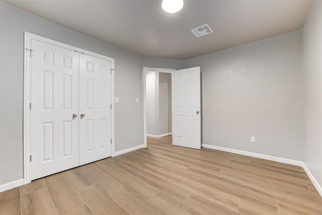 3128 NW 44th St, Oklahoma City, OK 73112 - unfurnished bedroom featuring baseboards, light wood-style flooring, and a closet