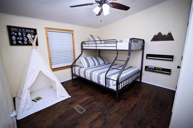 78 Lionfish Rd, Broken Bow, OK 74728 - bedroom featuring wood finished floors, baseboards, crown molding, a ceiling fan, and a textured ceiling